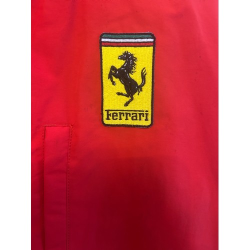 108 - THREE BRANDED FERRARI JACKETSA 1990s Tommy Hilfiger Ferrari jacket in red polyester, windbreaker sty... 
