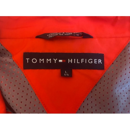 108 - THREE BRANDED FERRARI JACKETSA 1990s Tommy Hilfiger Ferrari jacket in red polyester, windbreaker sty... 