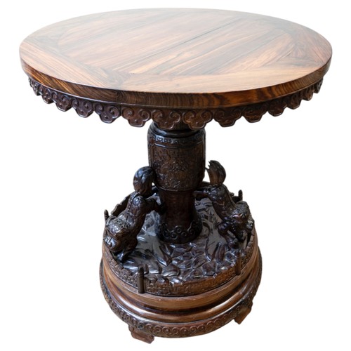 A FINE HUANGHUALI ROUND 'BUDDHIST LIONS' TABLE