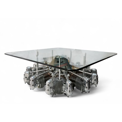 A LARGE GLASS TOPPED COFFEE TABLE BASED ON A SEVEN-CYLINDER 757CI R-755 RADIAL ENGINE 