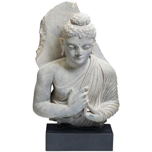 A RARE GREY SCHIST CARVED BUDDHA