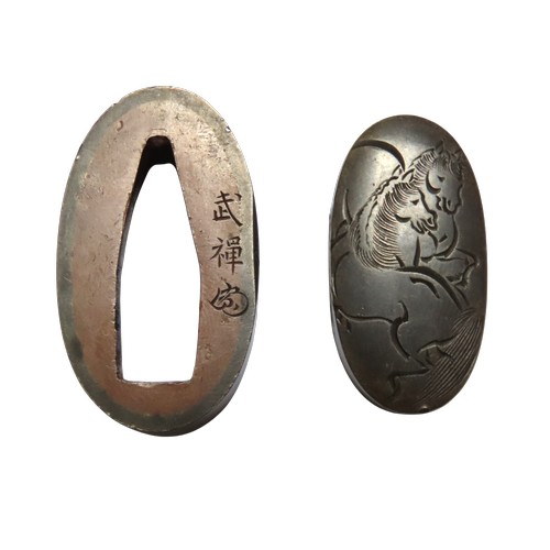 A FUCHI-KASHIRA, mei, Suminoe Buzen, (1736-1806) of Osaka, Haynes Ref. H00242.0., shakudo decorated in the katakiribori technique, the kashira with three horses, the fuchi with three playfully animated horses kicking, Edo period, in a wooden presentation box the box lid with paper lablelfrom the Toso Kinko Jiten by Wakayama Takeshi. 4 cms max