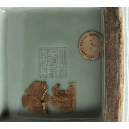 31 - A FINE MOULDED CELADON-GLAZED 'DRAGON' VASES WITH SWASTIKA IMPRESSED QIANLONG SEAL MARK, LATE QING D... 