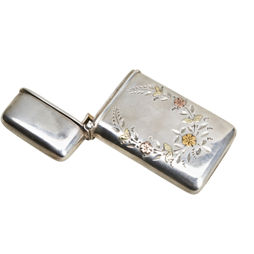 30 - A VESTA CASE OVERLAID WITH GOLD FLOWERS, AMERICAN C.1910The vesta is marked 'STERLING