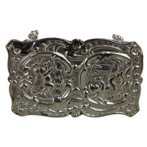 7 - A SILVER MINIATURE TABLE AND TWO MINIATURE CHAIRSthe repousse decorated table marked Birmingham, 190... 