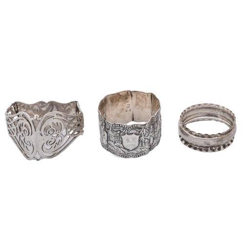 21 - SEVEN SILVER NAPKIN RINGSa pill box, a matchbox sleeve, a personal ashtray and a pair of knife rests... 