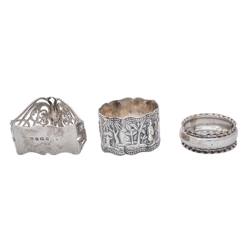 21 - SEVEN SILVER NAPKIN RINGSa pill box, a matchbox sleeve, a personal ashtray and a pair of knife rests... 