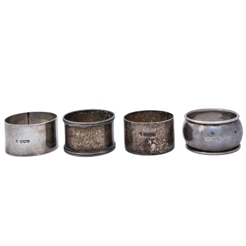 21 - SEVEN SILVER NAPKIN RINGSa pill box, a matchbox sleeve, a personal ashtray and a pair of knife rests... 