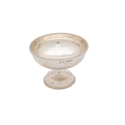 38 - A SILVER BOWLBirmingham, 1932, a small silver bowl with raised feet, an 800 standard silver salt and... 