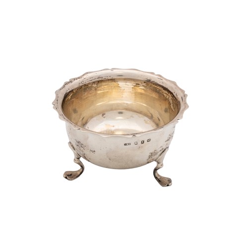 38 - A SILVER BOWLBirmingham, 1932, a small silver bowl with raised feet, an 800 standard silver salt and... 