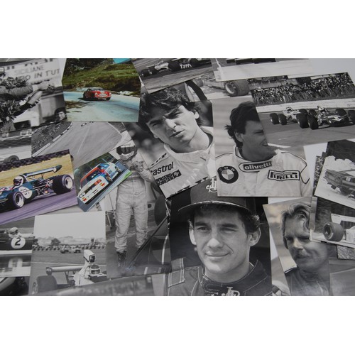 109 - c.100 Motor Racing PhotographsA collection of motor racing images, including action shots and driver... 