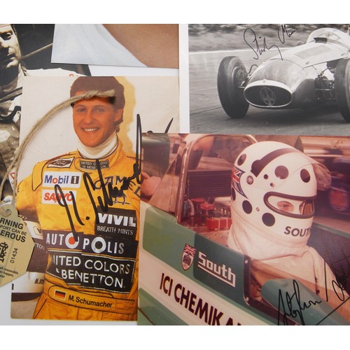 115 - Fourteen Signed Racing Driver PhotosFeaturing:Michael SchumacherJohn SurteesStirling MossVic ElfordJ... 