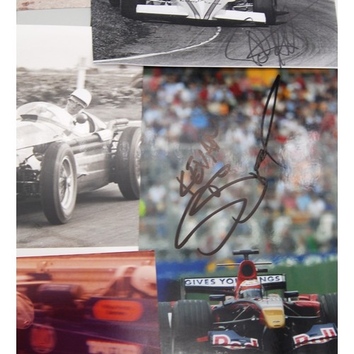 115 - Fourteen Signed Racing Driver PhotosFeaturing:Michael SchumacherJohn SurteesStirling MossVic ElfordJ... 