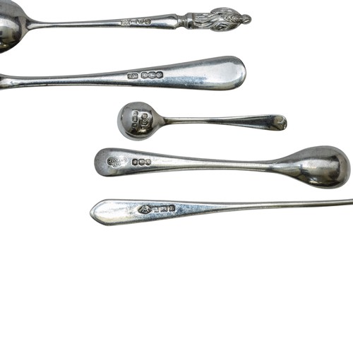 24 - A MIXED GROUP OF SILVER SPOONSincluding five 'aspostle' tea spoons, a pair of ornate scroll handle t... 