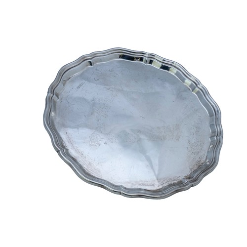 60 - A CIRCULAR SILVER TRAYwith scroll edgeBirmingham marked (rubbed and indistinct)25 cm diam, 445 grams... 