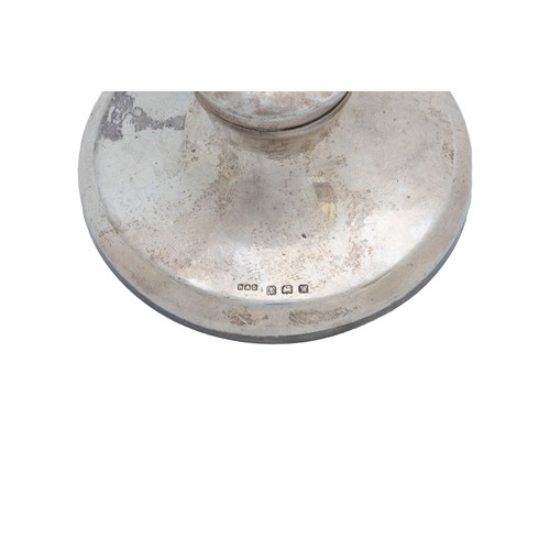 22 - A SILVER CAPSTAN INKWELLBirmingham, 1912, two others and a silver dressing table box, all loaded and... 