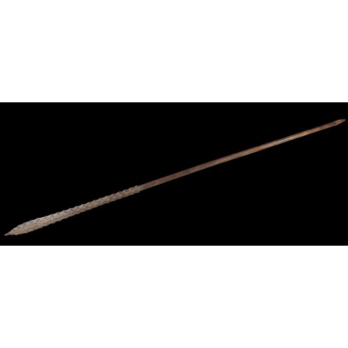 AN EXCEPTIONAL COOK ISLANDS POLE CLUB 'AKATARA', from Rarotonga or Atiu, carved from the heart of the ironwood tree (toa), the narrow elliptical  'blade' with forty six scallop shaped depressions on each side, the tip formed as a small serrated point and terminating on the haft in two sets of stylised eyes, the base of the shaft carved with  two chevrons. 19th century. 259 cms long.