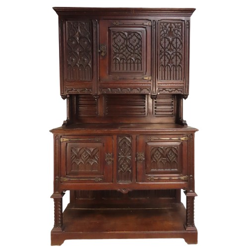 28 - AN IMPRESSIVE OAK GOTHIC REVIVAL CABINETLATE 19TH CENTURYin two sections228 x 140 x 54 cmProvenance:... 
