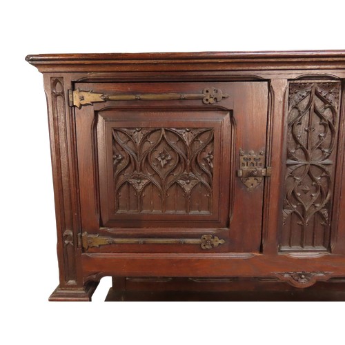 28 - AN IMPRESSIVE OAK GOTHIC REVIVAL CABINETLATE 19TH CENTURYin two sections228 x 140 x 54 cmProvenance:... 