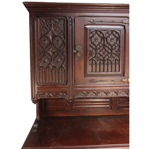 28 - AN IMPRESSIVE OAK GOTHIC REVIVAL CABINETLATE 19TH CENTURYin two sections228 x 140 x 54 cmProvenance:... 