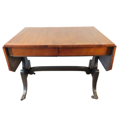 2 - A ROSEWOOD SOFA TABLELATE 19TH CENTURYthe rectangular top and drop-flaps with line inlay, above two ... 