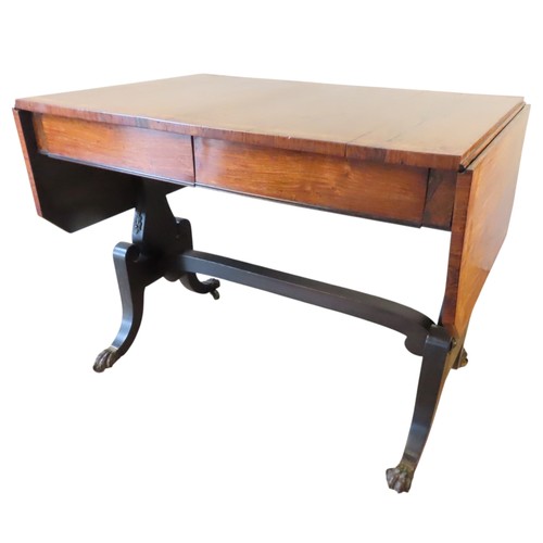 2 - A ROSEWOOD SOFA TABLELATE 19TH CENTURYthe rectangular top and drop-flaps with line inlay, above two ... 