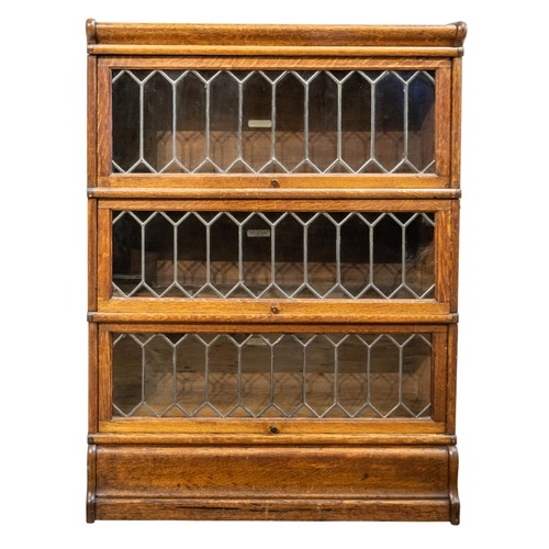 10 - A GLOBE WERNICKE OAK STACKING BOOKCASEEARLY 20TH CENTURYcomprised of three sections with glazed lead... 