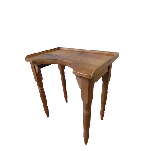 15 - A WAXED PINE JEWELLER'S WORK TABLErectangular top with three quarter gallery and concave edge, raise... 