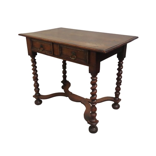14 - AN OAK SIDE TABLELATE 19TH CENTURYraised on four barley twist legs tied by an X-form stretcher75 x 9... 