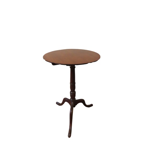 41 - A MAHOGANY TRIPOD TABLE19TH CENTURYthe tilting circular top raised on a ring turned pillar, on down ... 