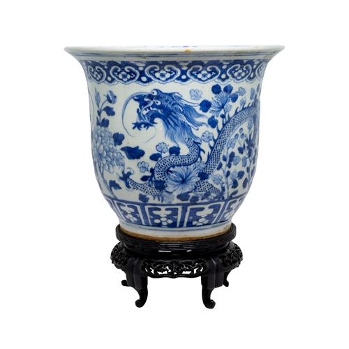 43 - A BLUE AND WHITE 'DRAGON' JARDINIERE LATE QING DYANSTYwith a carved hardwood stand27.5cm diameterPRO... 