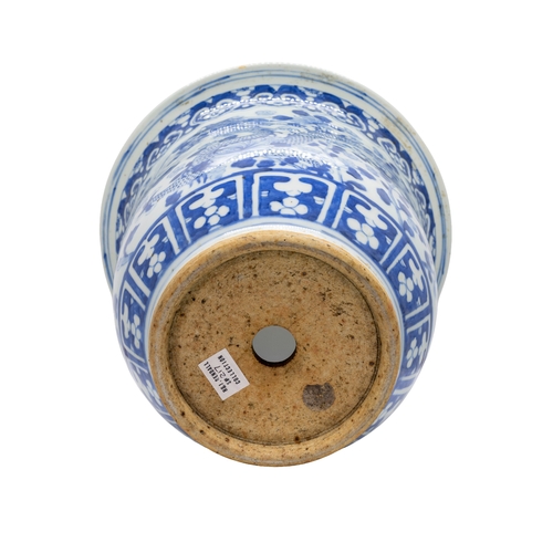 43 - A BLUE AND WHITE 'DRAGON' JARDINIERE LATE QING DYANSTYwith a carved hardwood stand27.5cm diameterPRO... 