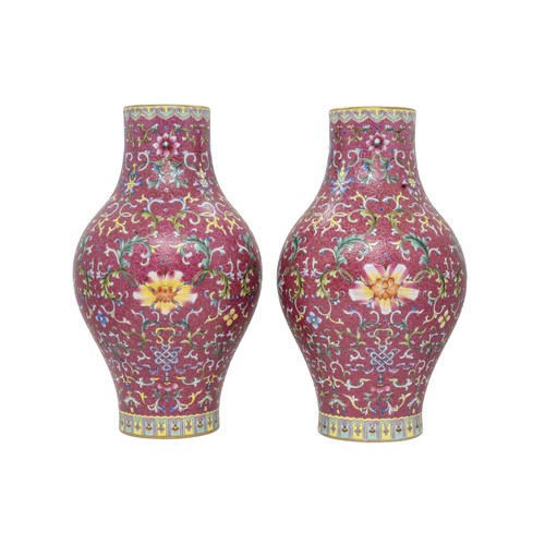 A PAIR OF CHINESE RUBY-GROUND SGRAFFIATO FAMILLE ROSE 'LOTUS' VASES