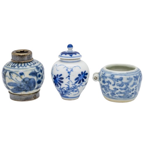 49 - A BLUE AND WHITE 'LOTUS' BIRD FEEDERQING DYNASTY5cm wide; together with A SMALL BLUE AND WHITE JAR A... 