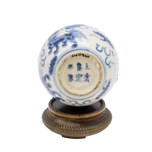 55 - A SMALL SOFT-PASTE BLUE AND WHITE 'BUDDHIST-LION' JARLETKANGXI SIX CHARACTER MARK, LATE QING DYNASTY... 