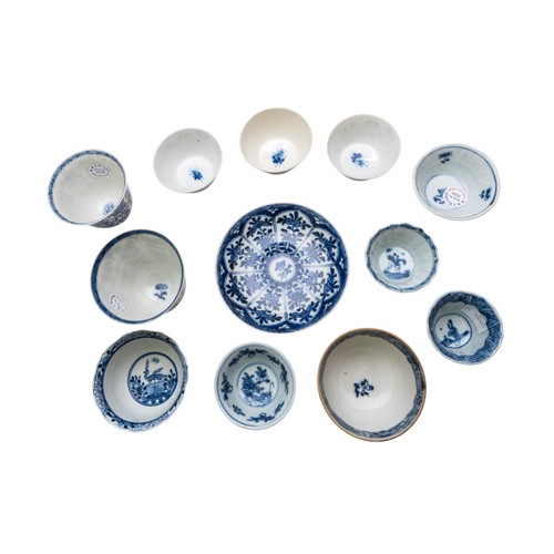 56 - A GROUP OF CHINESE BLUE AND WHITE TEA BOWLS AND A SAUCERQING DYNASTY, 18TH CENTURY (12)Smallest 3cm,... 