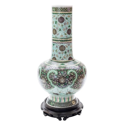 165 - A GOOD FAMILLE VERTE BOTTLE VASEQING DYNASTY, 19TH CENTURYwith a carved hardwood stand45cm highPROVE... 