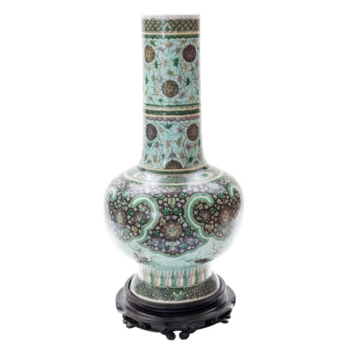 165 - A GOOD FAMILLE VERTE BOTTLE VASEQING DYNASTY, 19TH CENTURYwith a carved hardwood stand45cm highPROVE... 