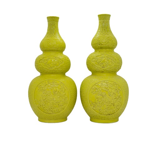32 - A PAIR OF TRIPLE-GOURD CARVED YELLOW-GLAZE VASES QIANLONG IMPRESSED MARKS, 20TH CENTURY29cm highPROV... 