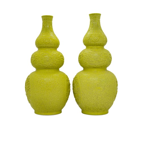 32 - A PAIR OF TRIPLE-GOURD CARVED YELLOW-GLAZE VASES QIANLONG IMPRESSED MARKS, 20TH CENTURY29cm highPROV... 