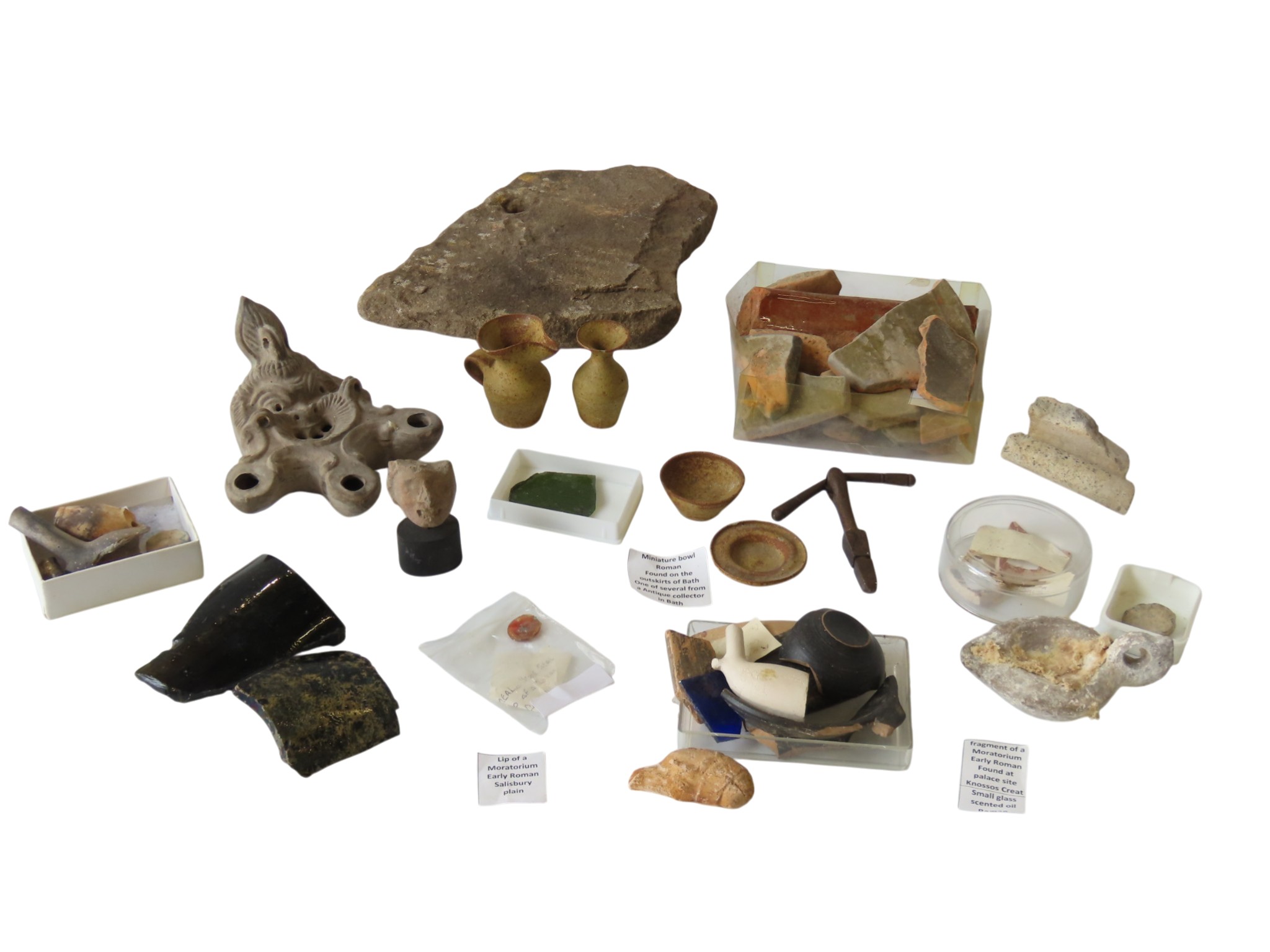 A ROMAN RAGSTONE ROOF TILE, two pottery sherds from Petra, some Attic ...