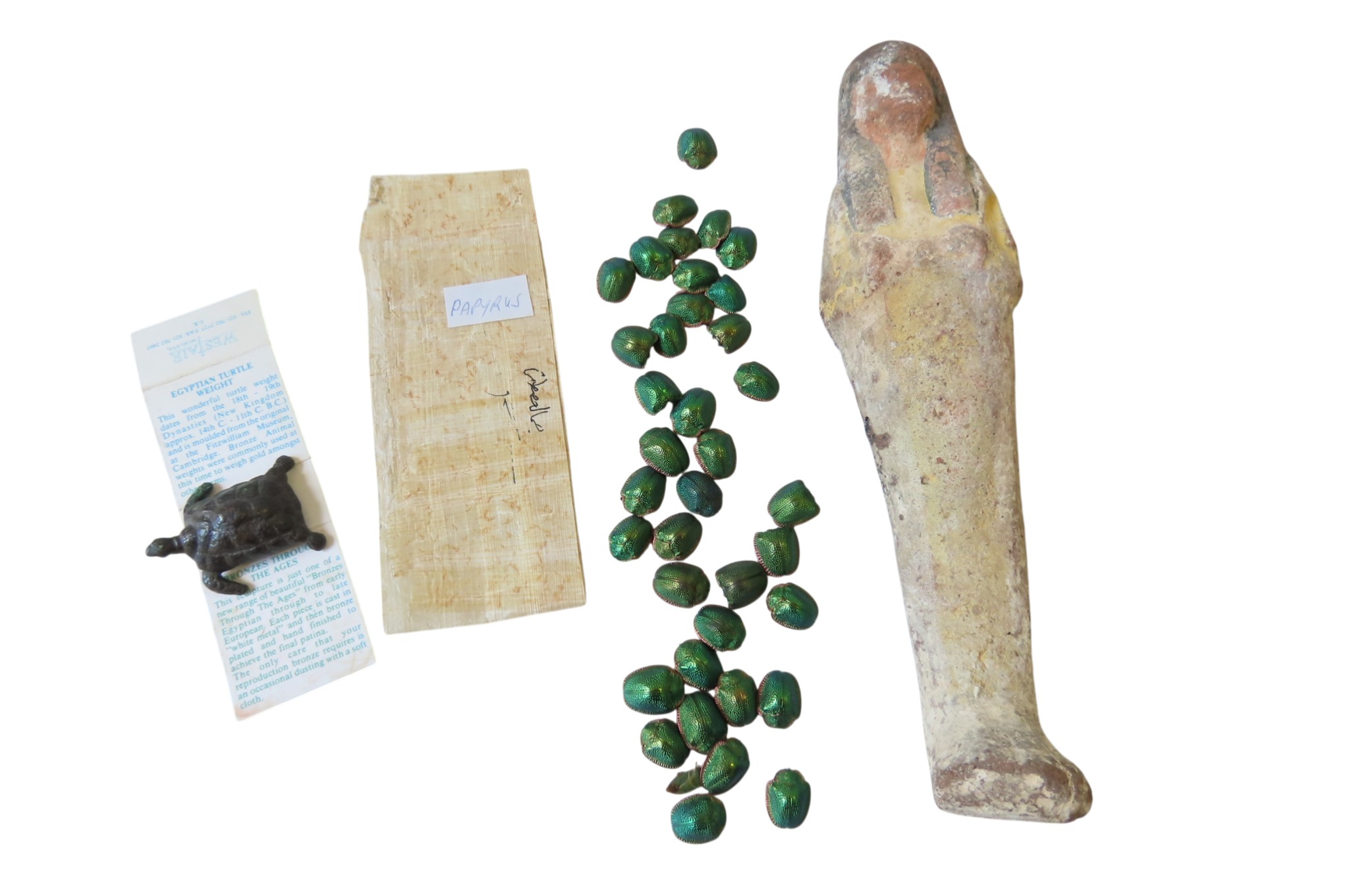 AN EGYPTIAN POTTERY SHABTI, a section of papyrus, a reproduction ...