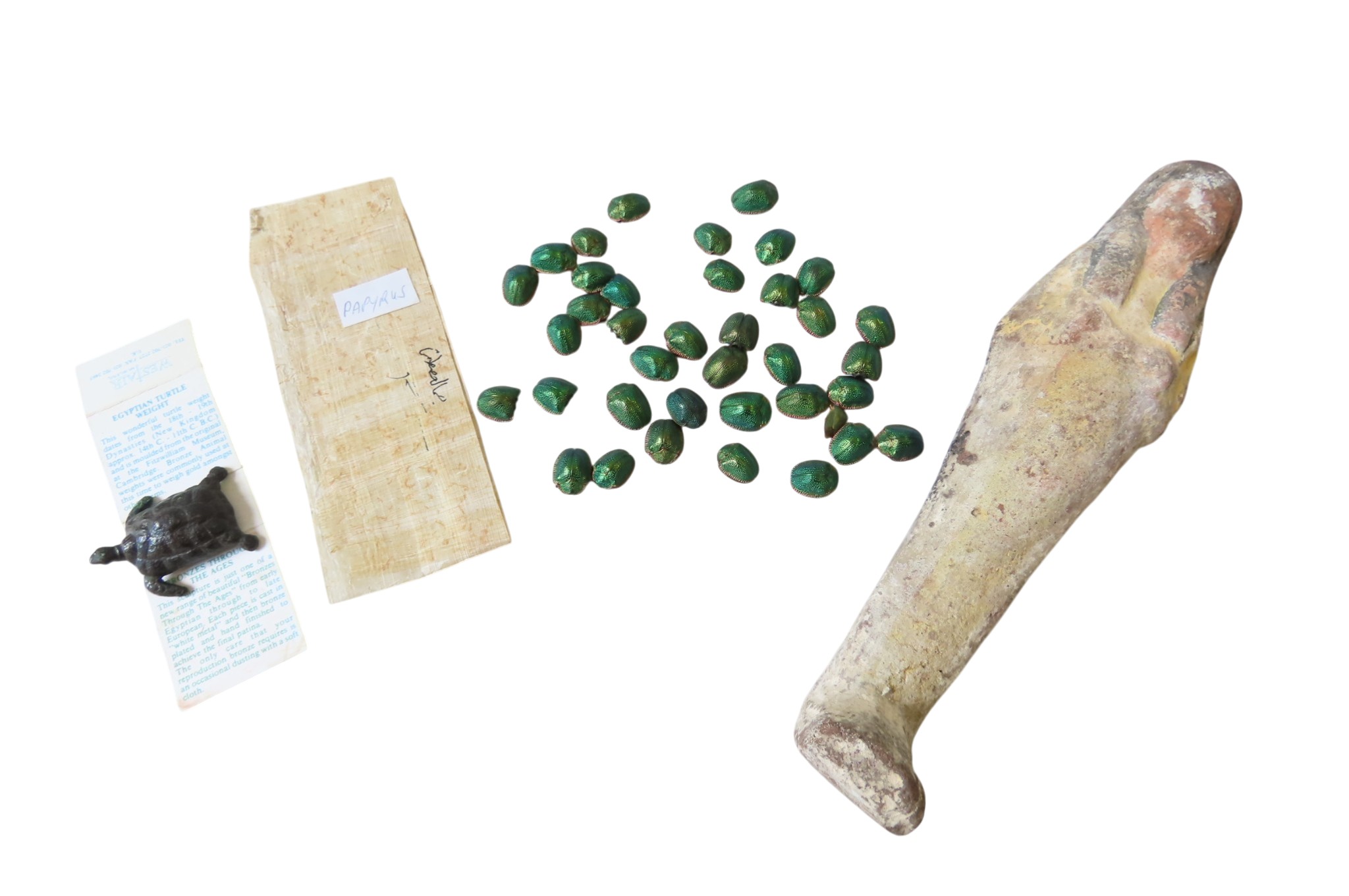 AN EGYPTIAN POTTERY SHABTI, a section of papyrus, a reproduction ...