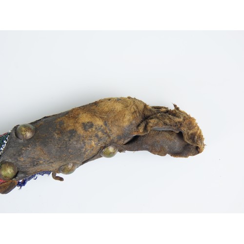 A NATIVE AMERICAN PLAINS STONE WAR CLUB, the ovoid stone head bound ...