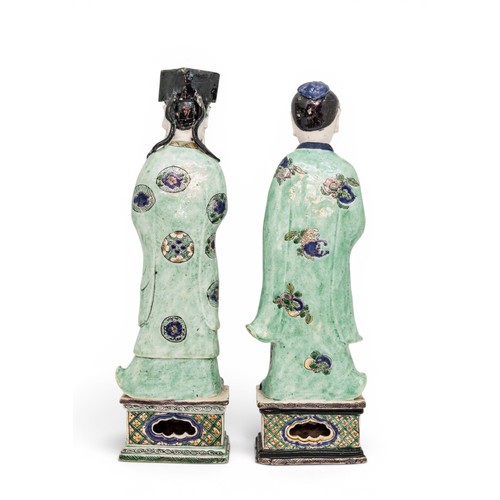 6 - A RARE PAIR OF CHINESE FAMILLE VERTE BISCUIT PORCELAIN FIGURES OF THE STANDING IMMORTALS LAN CAIHE H... 
