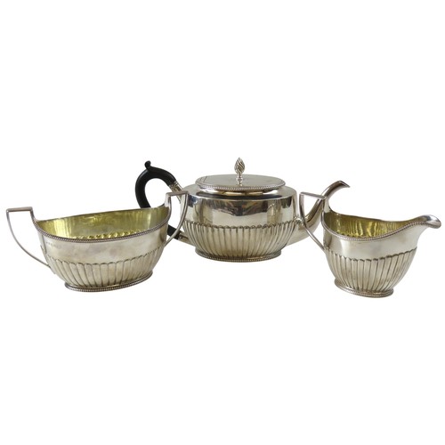 A GEORGE III SILVER TEA POT