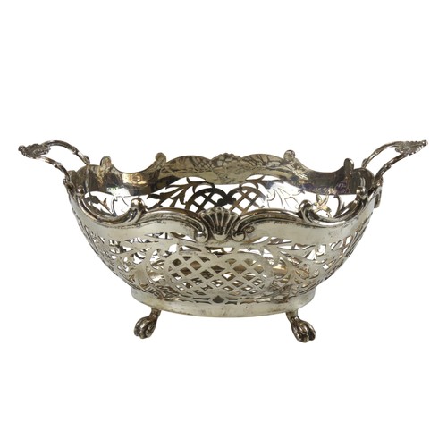 44 - A DUTCH SILVER SWEETMEAT BASKETwith scrolling ring handles and pierced lattice sides, raised on four... 
