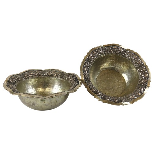 57 - A PAIR OF PLANISHED CONTINENTAL SILVER BOWLSwith scroll foliate repousse rims and scrolling edgesmar... 