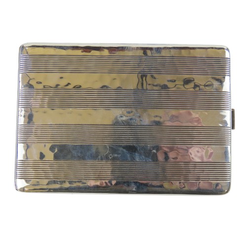35 - A GERMAN SILVER CIGARETTE CASErectangular form with planished finish and bands of linear decorationm... 