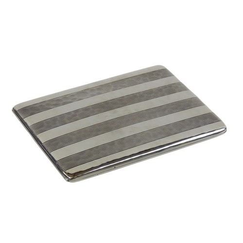 35 - A GERMAN SILVER CIGARETTE CASErectangular form with planished finish and bands of linear decorationm... 